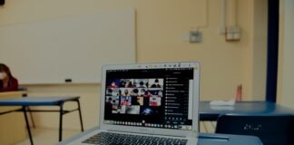 macbook pro on blue table