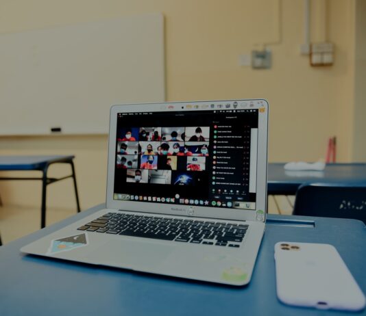 macbook pro on blue table