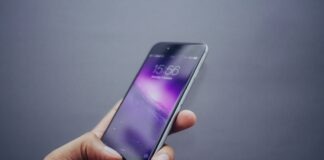 person holding space gray iPhone X