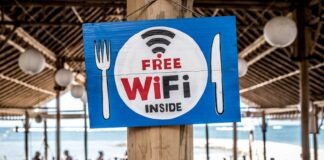 Free WiFi signage on wooden post