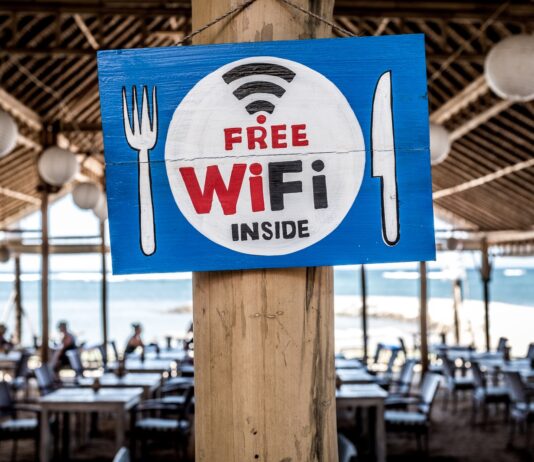 Free WiFi signage on wooden post