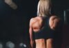 woman wearing black sports bra facing front selective focus photography