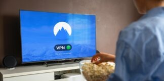 black flat screen tv turned on displaying blue screen