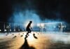 person playing soccer on field