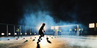 person playing soccer on field