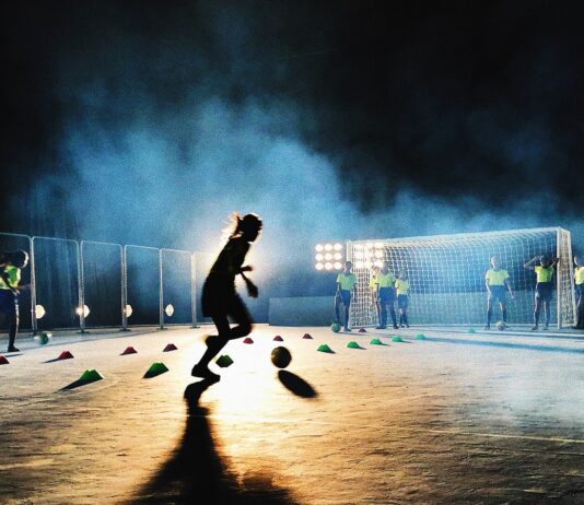person playing soccer on field