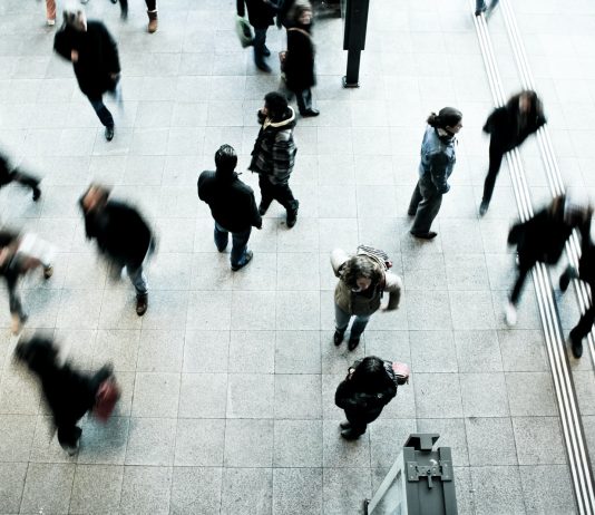 people walking on grey concrete floor during daytime