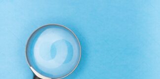 magnifying glass on white table