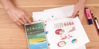 person holding white Samsung Galaxy Tab