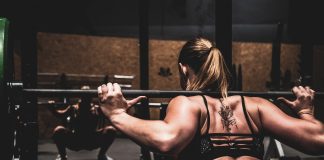 woman lifting barbel