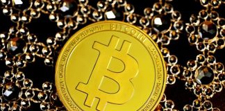 gold round coin on black beads