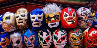 assorted-color of masks hanged on rod