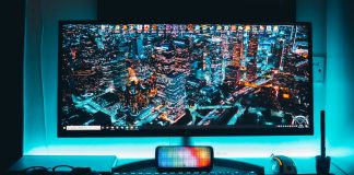 turned-on flat screen television