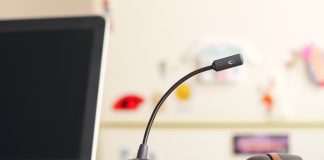 black and brown headset near laptop computer