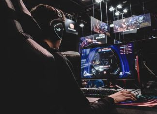 A Unique Guide to the Video Game Industry: Game Art and Video Production Run Down person sitting on gaming chair while playing video game