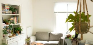 gray fabric loveseat near brown wooden table