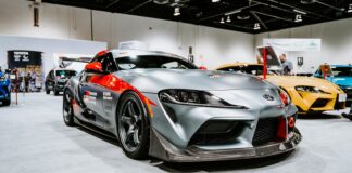 silver porsche 911 parked in a room