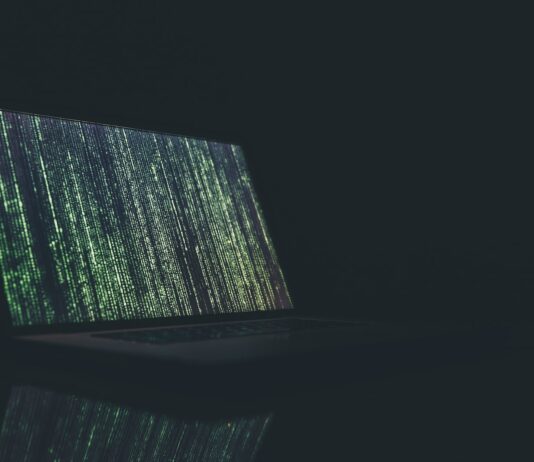 black and gray laptop computer turned on