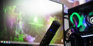 black microphone beside black flat screen computer monitor