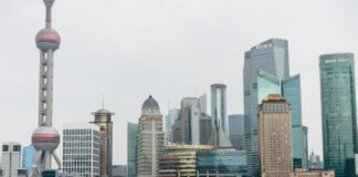 gray and red passenger boat on body of water