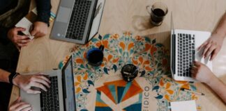 three person using laptops