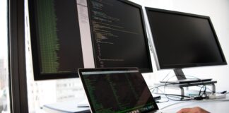 shallow focus photo of person using MacBook