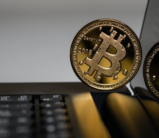 two gold Bitcoins