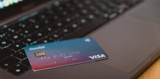 blue and white visa card on silver laptop computer