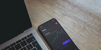 black android smartphone on macbook pro