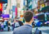 shallow focus photography of man in suit jacket's back