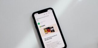 black iphone 5 on white table