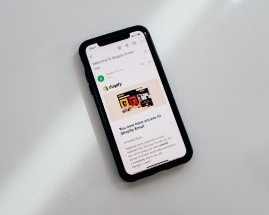 black iphone 5 on white table