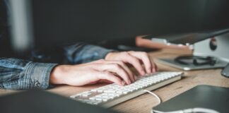 person using computer keyboard