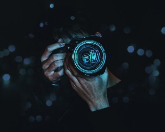 person holding black camera