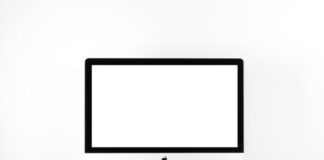 silver iMac with Apple Magic Keyboard on white sufrace