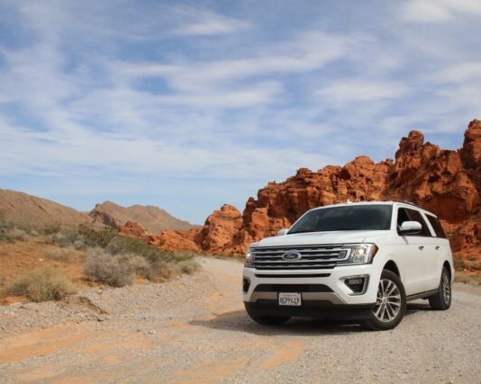 parked white Ford Explorer SUV