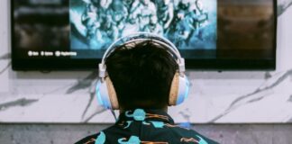 woman in black and white floral shirt standing in front of black and white wall