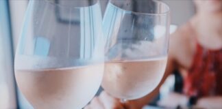 two person toasting wine glass cups