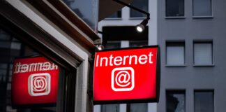 Internet LED signage beside building near buildings