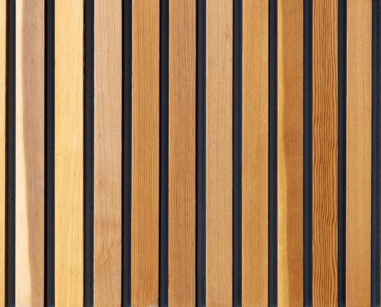 two brown wooden wall decors