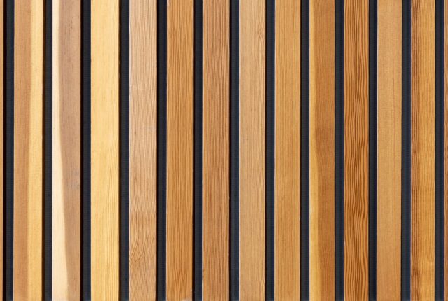 two brown wooden wall decors