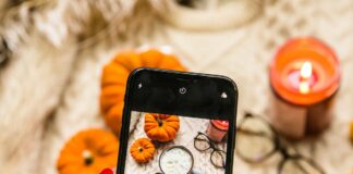 person holding black iphone 4