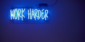 blue Work Harder neon signage