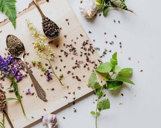 Herbs and Spices on Brown Wooden Chopping Board