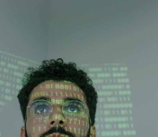 Man With Binary Code Projected on His Face