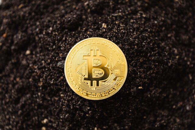Photo by Karolina Grabowska Close-Up Shot of a Bitcoin on the ground