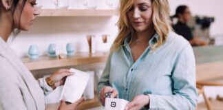 woman holding white pack