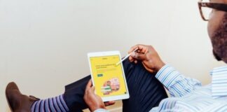 a man holding a tablet