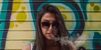 woman wearing blue and white floral sleeveless top