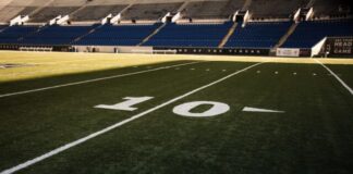 soccer players on soccer field during daytime